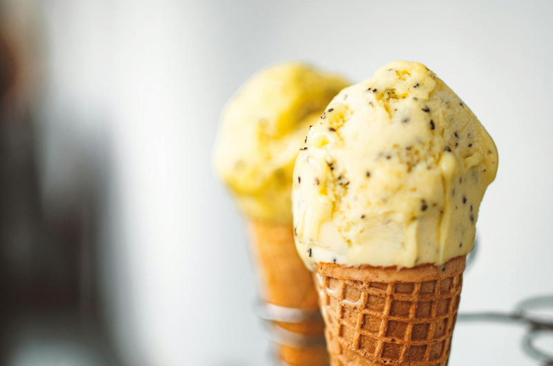 The image shows two freshly filled ice cream cones.