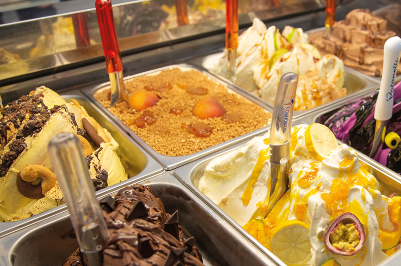 Display cabinet containing an assortment of ice cream and sorbet flavours.